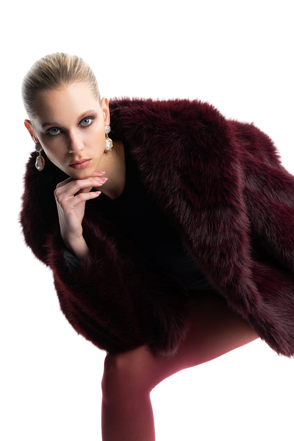 Editorial shot in a burgundy fur coat